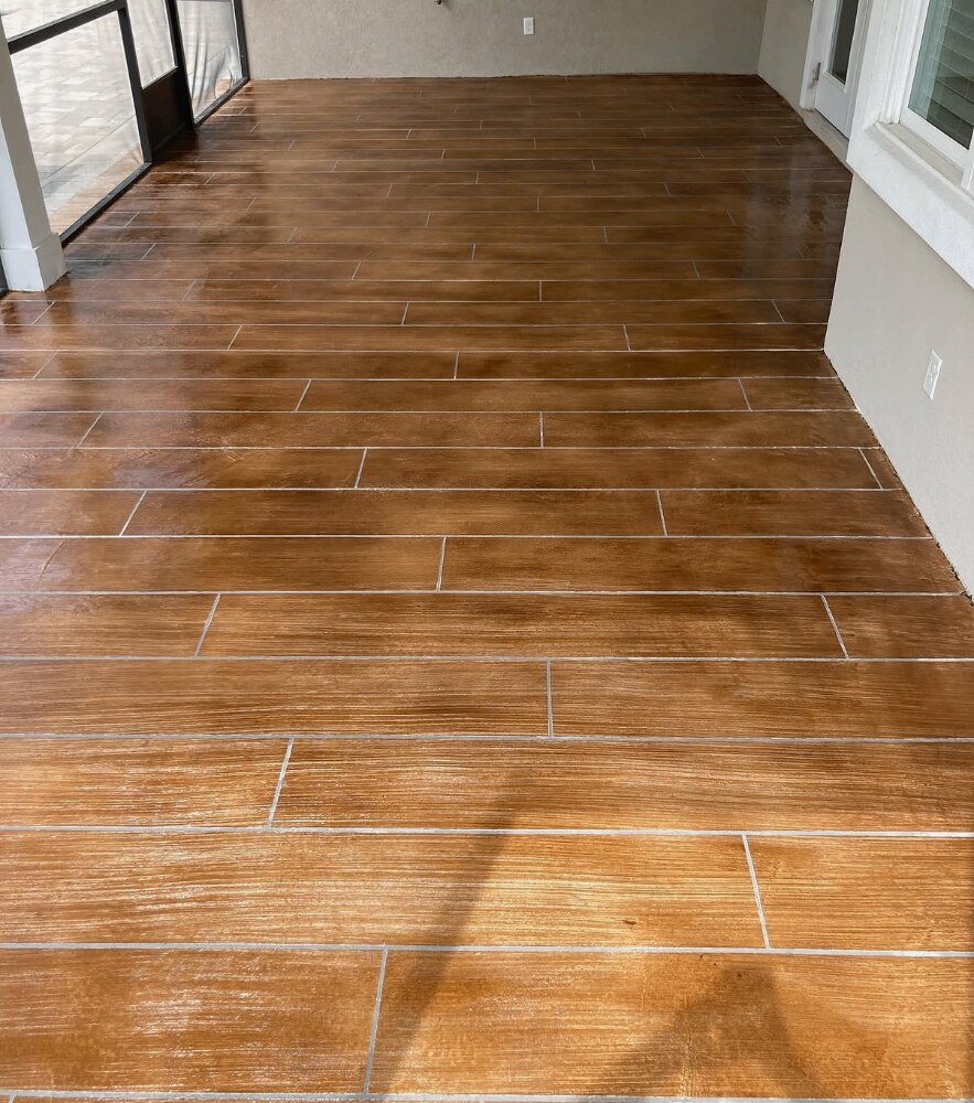 Wood grain decorative concrete overlay on a waterfront patio
